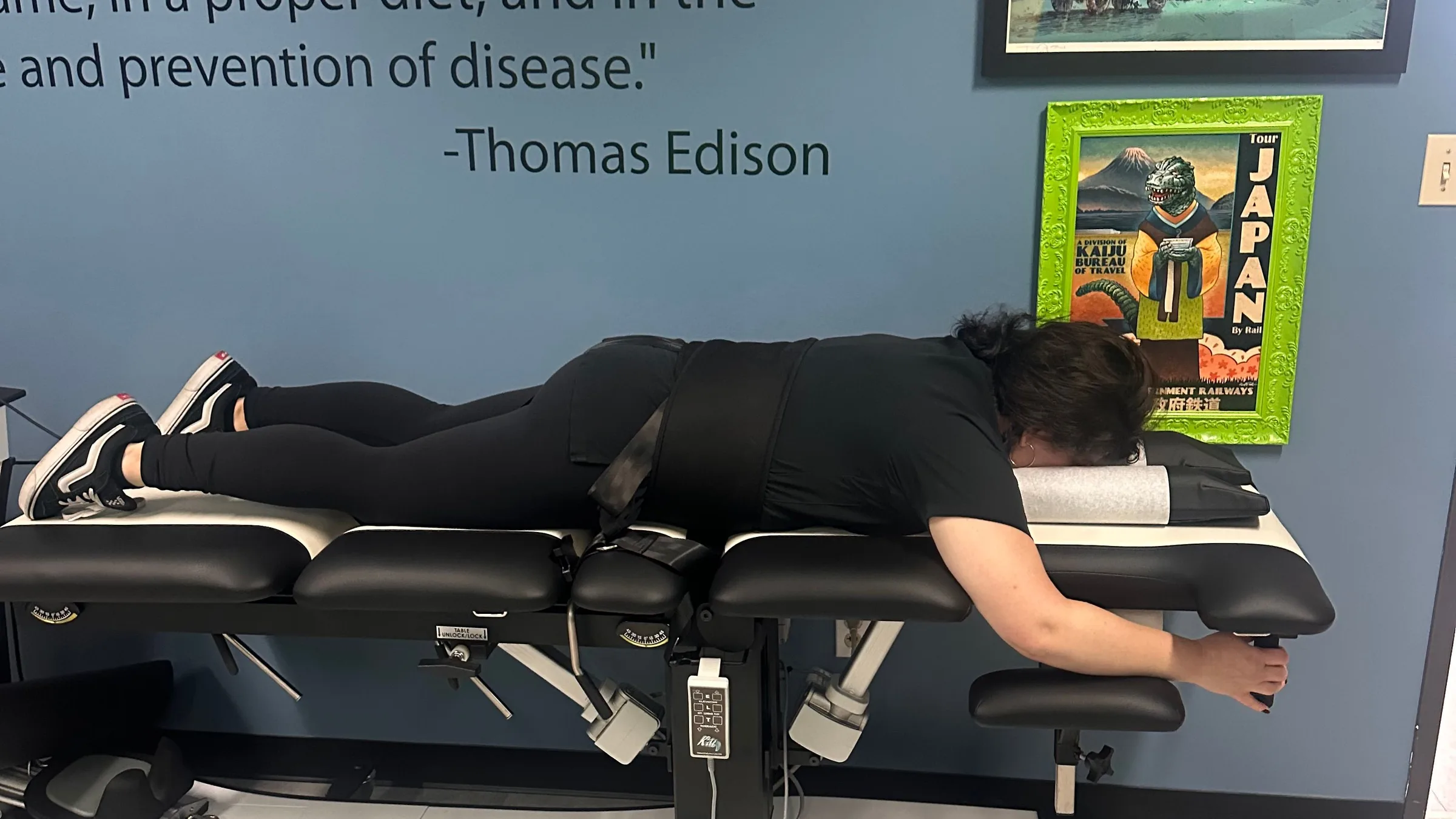 Patient lying face down on a spinal decompression table